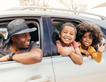 family in car for trip